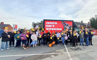 Sarah Atherton MP in front of the 20mph battle bus